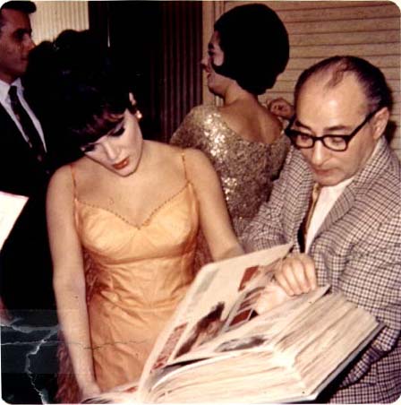 Connie and George Scheck examining fan scrapbook