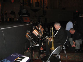 orchestra horns in front of audience front row