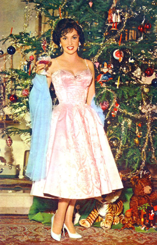 Gina by Christmas tree