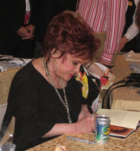 Connie signing one of several autographs