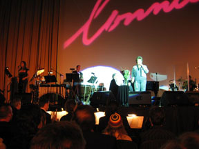 Connie on stage, her signature in background