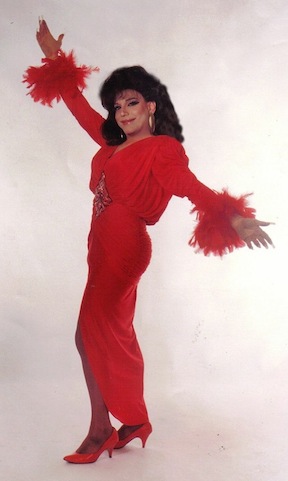 Joey standing in a beautiful red dress
